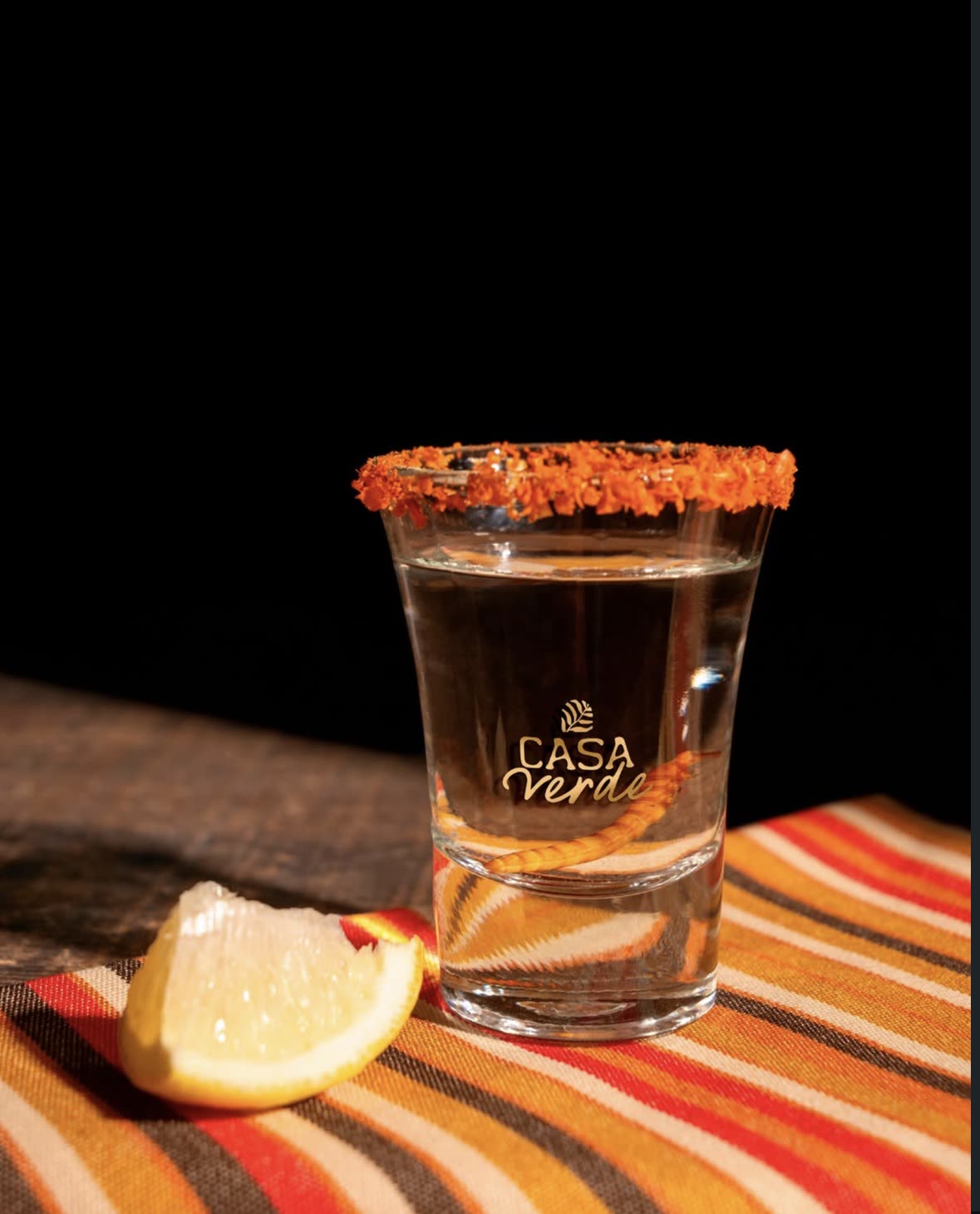 Tequila shot with the Casa Verde logo